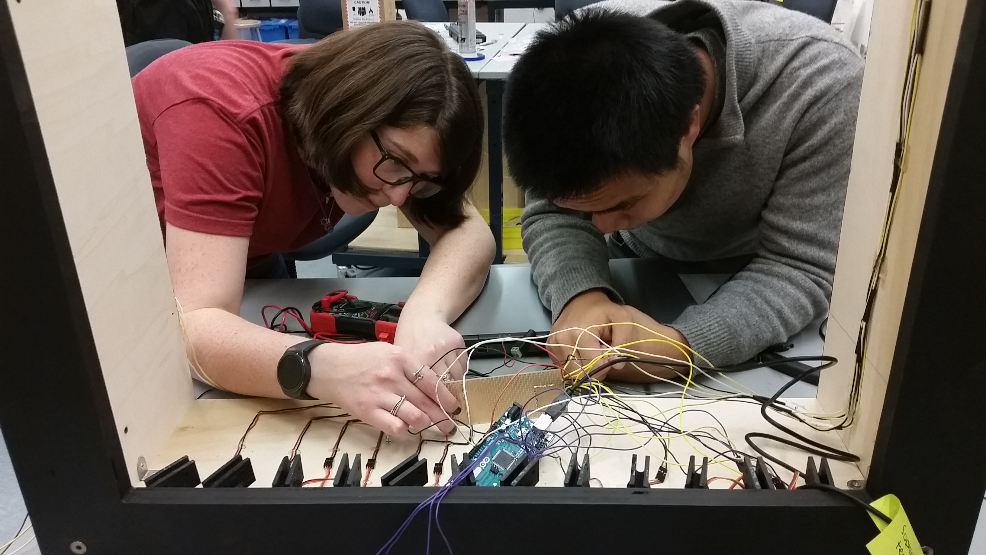 The two members of the ECE subteam hard at work debugging circuit wiring problems