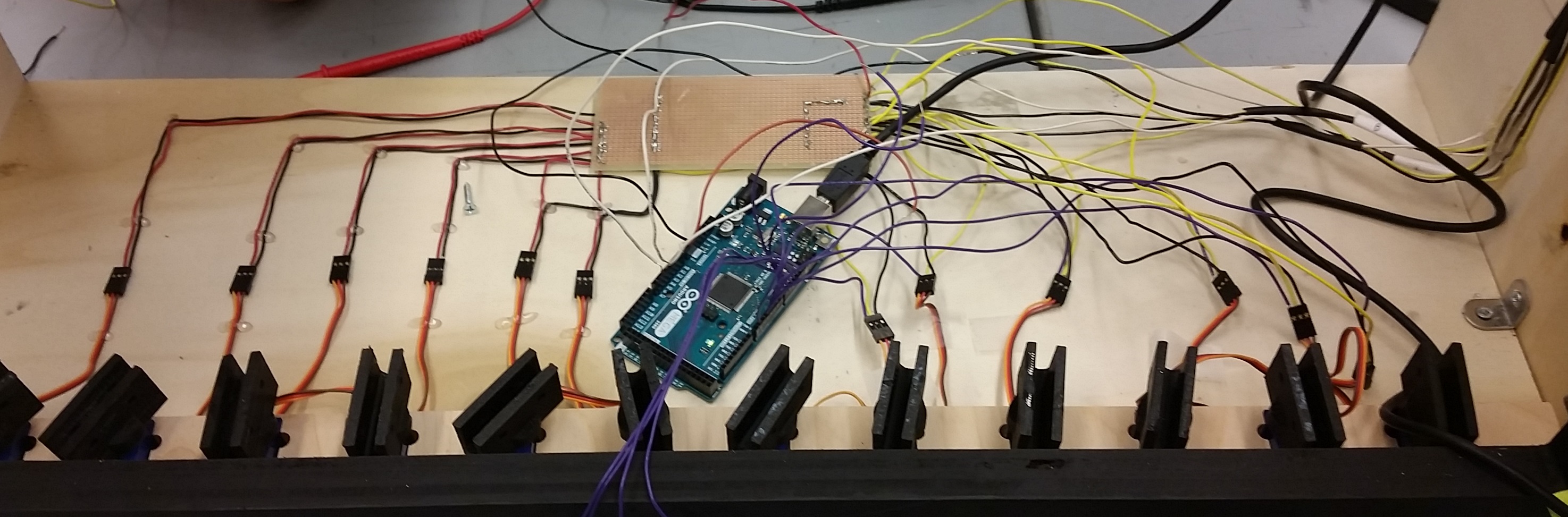 A close up view of the wires involved in our project from the servos and sensors to the protoboard and Arduino